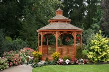 12′ Octagon • Double roof, Queen Anne railings and braces, redwood stain, slate shingles.