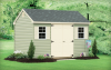 Standard Cape Cod 8′ x 16′ Sage vinyl siding, beige trim and shutters, black architectural shingles