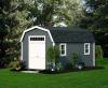 Deluxe Dutch Barn 10′ x 16′ Dark grey siding, white trim and doors, black architectural shingles